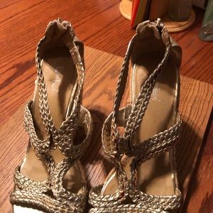 Gold wedge sandals.